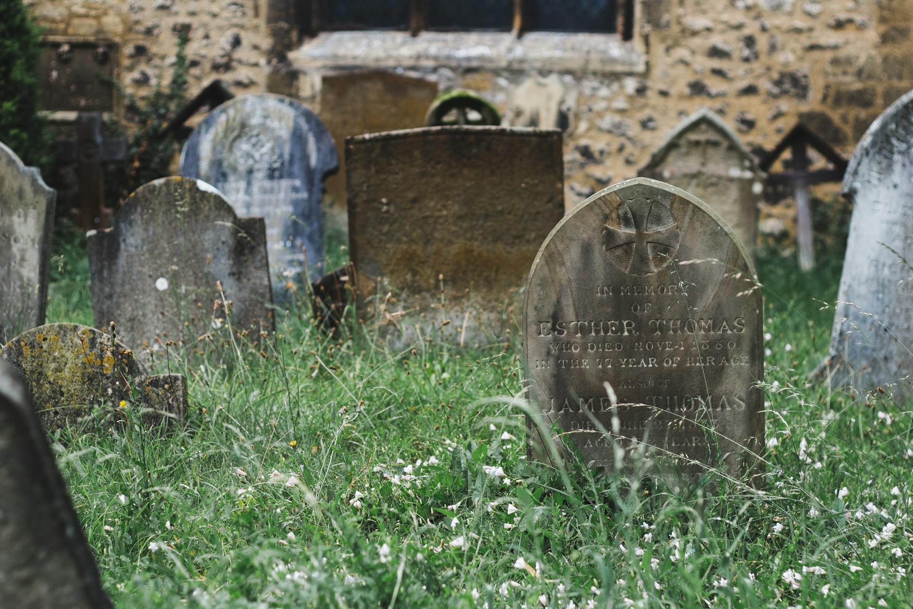 old christian cemetery with shabby tombstones