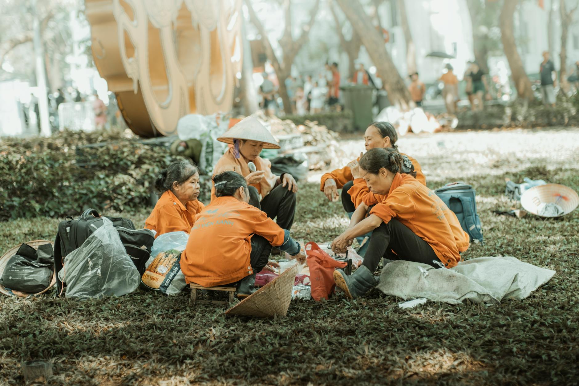 workers in orange jackets having break